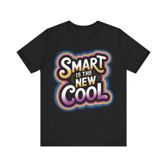 A black short-sleeve crewneck t-shirt featuring a colorful retro-style graphic on the chest that reads 'SMART IS THE NEW COOL' in white, yellow, orange, blue, and purple lettering.