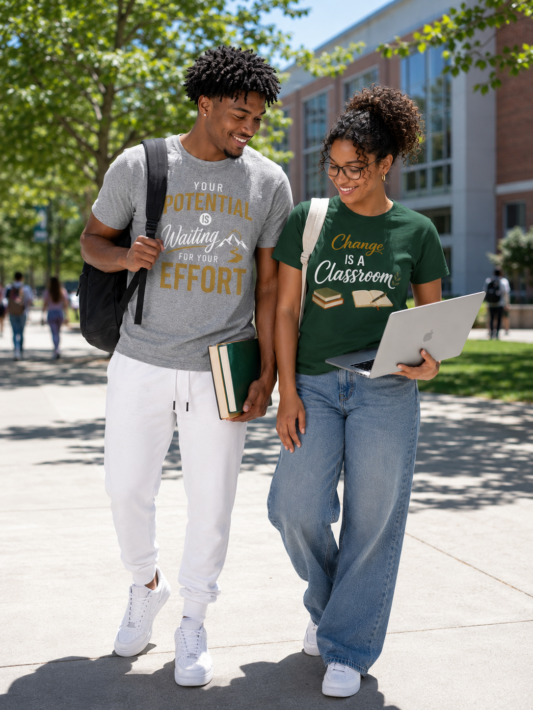 Two students, male and female, outside walking on campus with backpacks.  One has books and the order has an open laptop.  