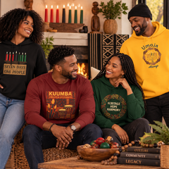 Black adults wearing Kwanzaa graphic apparel together in a warm festive gathering