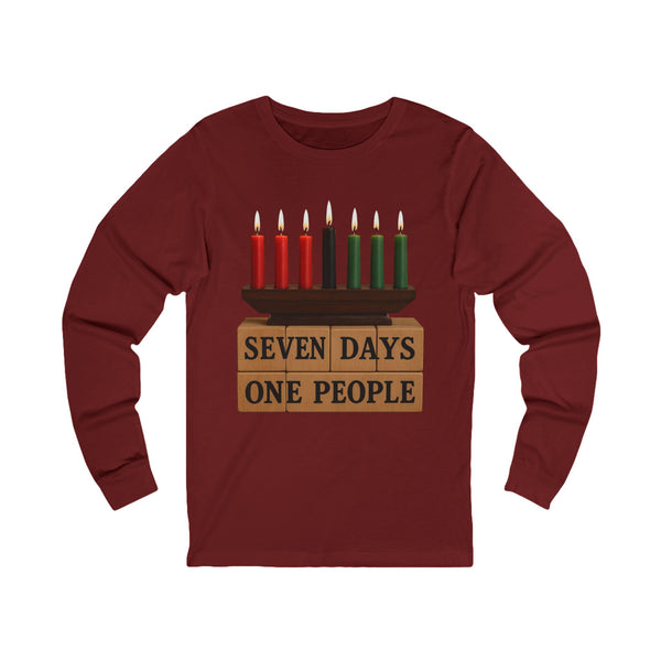 A maroon long-sleeve t-shirt with a graphic of a menorah on top of wooden blocks that read 'SEVEN DAYS ONE PEOPLE', set against a plain white background.