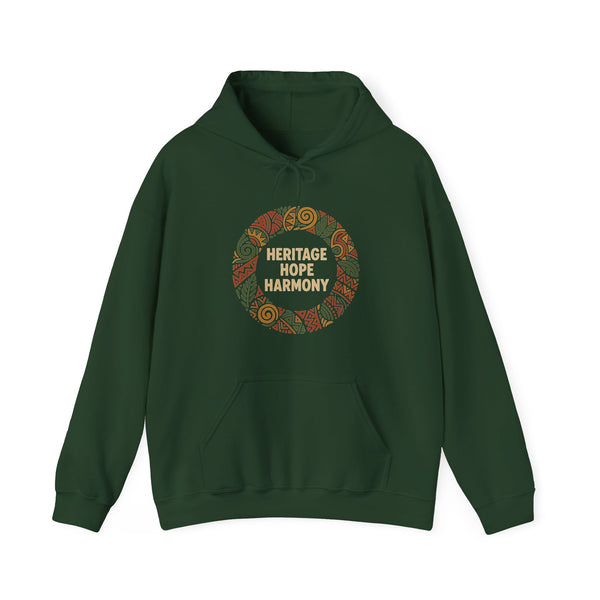 A dark green hoodie with a circular 'Heritage Hope Harmony' graphic on the chest, paired with blue jeans, against a plain white background.