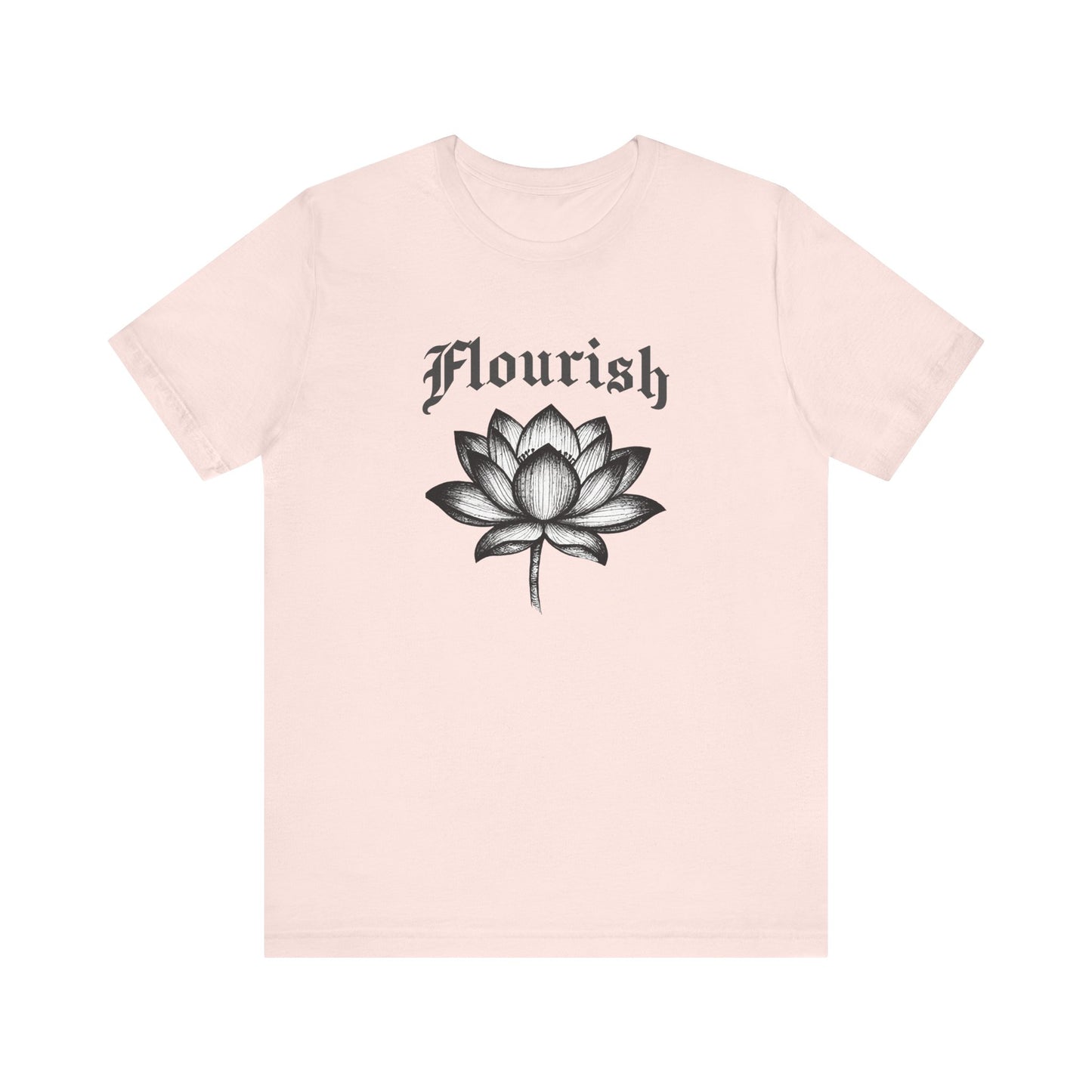 Soft pink t-shirt with black lotus flower and 'Flourish' text on a white background