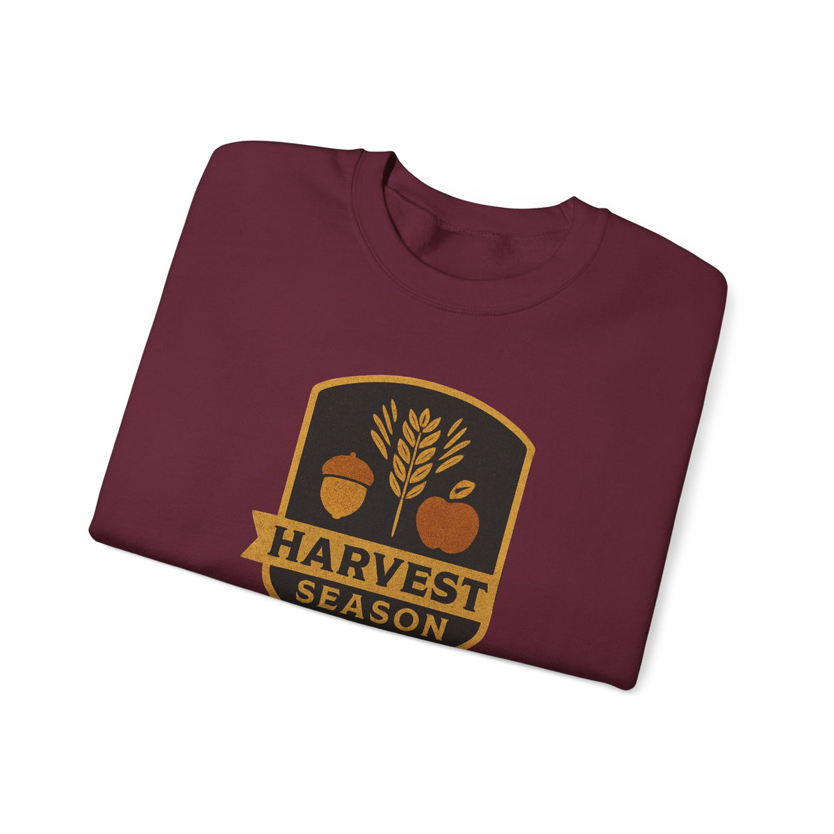 A folded maroon crewneck t-shirt with a 'Harvest Season' graphic on the chest, displayed on a clean white background.