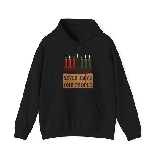 A black pullover hoodie with a graphic of a menorah featuring red and green candles and the text 'SEVEN DAYS ONE PEOPLE' printed on the chest, displayed against a plain white background.