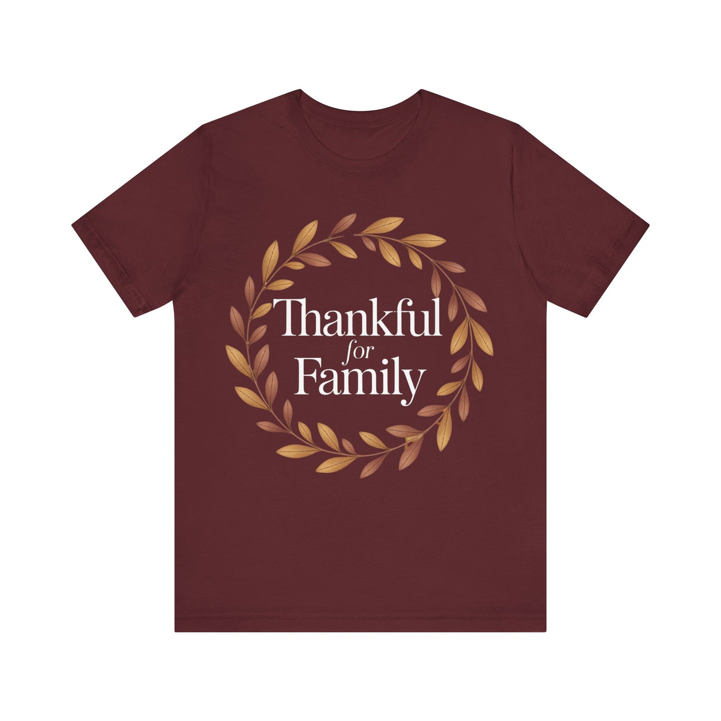 A maroon short-sleeve crewneck t-shirt featuring a circular graphic with a gold leaf wreath and the text 'Thankful for Family' in white, displayed on a solid white background.