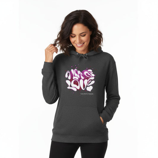 Woman wearing a dark gray hoodie with colorful text design on a white background