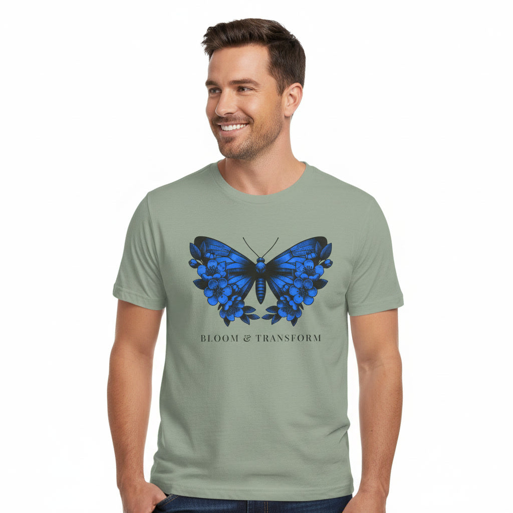 Man wearing a sage t-shirt with a blue butterfly design and text on a white background