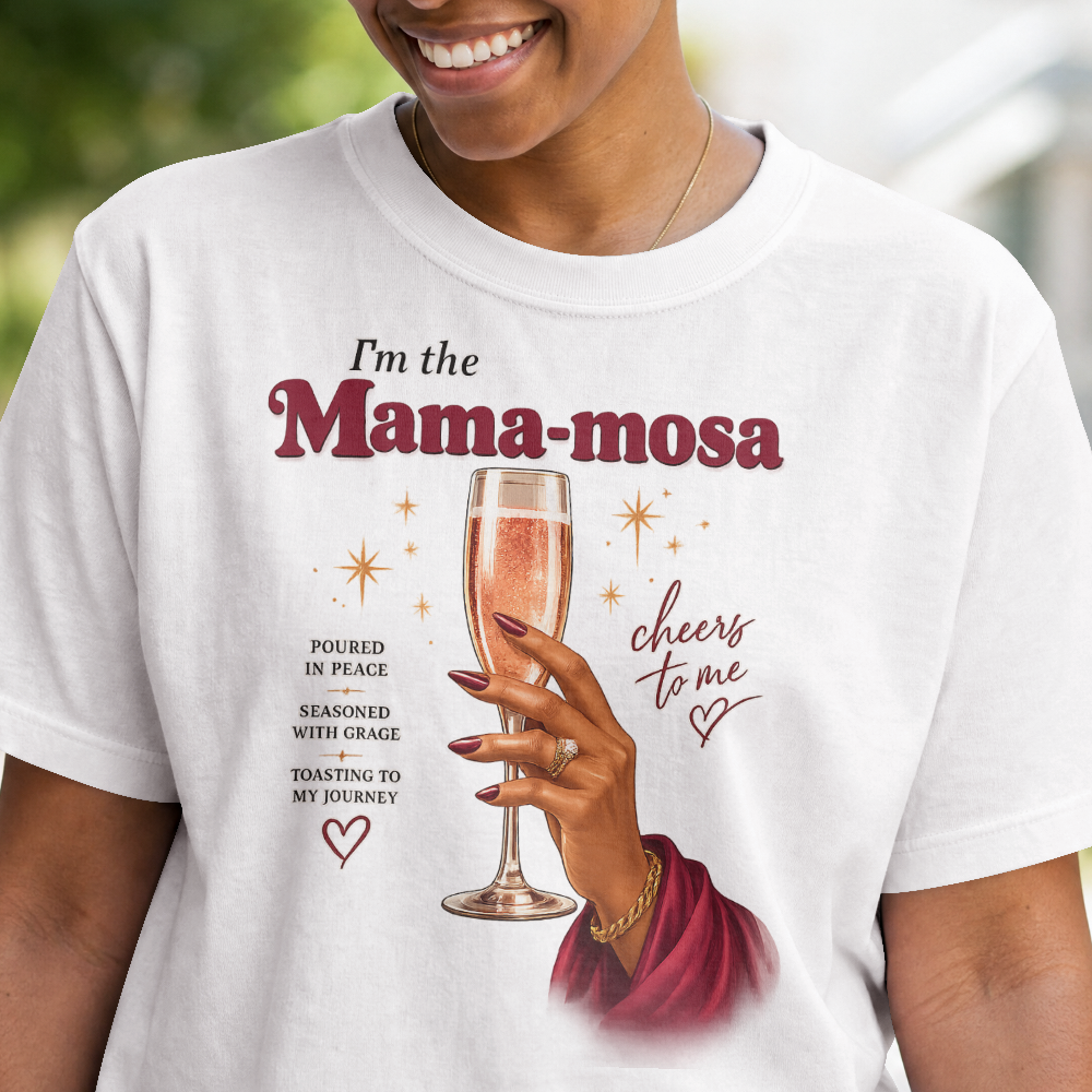 Person wearing a white t-shirt with a graphic of a hand holding a glass of champagne and text.