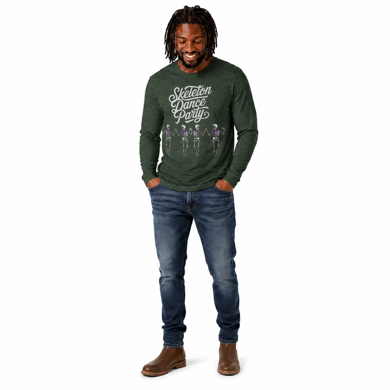 A man wearing a dark green long-sleeve t-shirt with a white graphic that reads 'Sexteen Dance Party' and purple skeleton figures, paired with blue jeans and brown boots, standing against a plain white background.