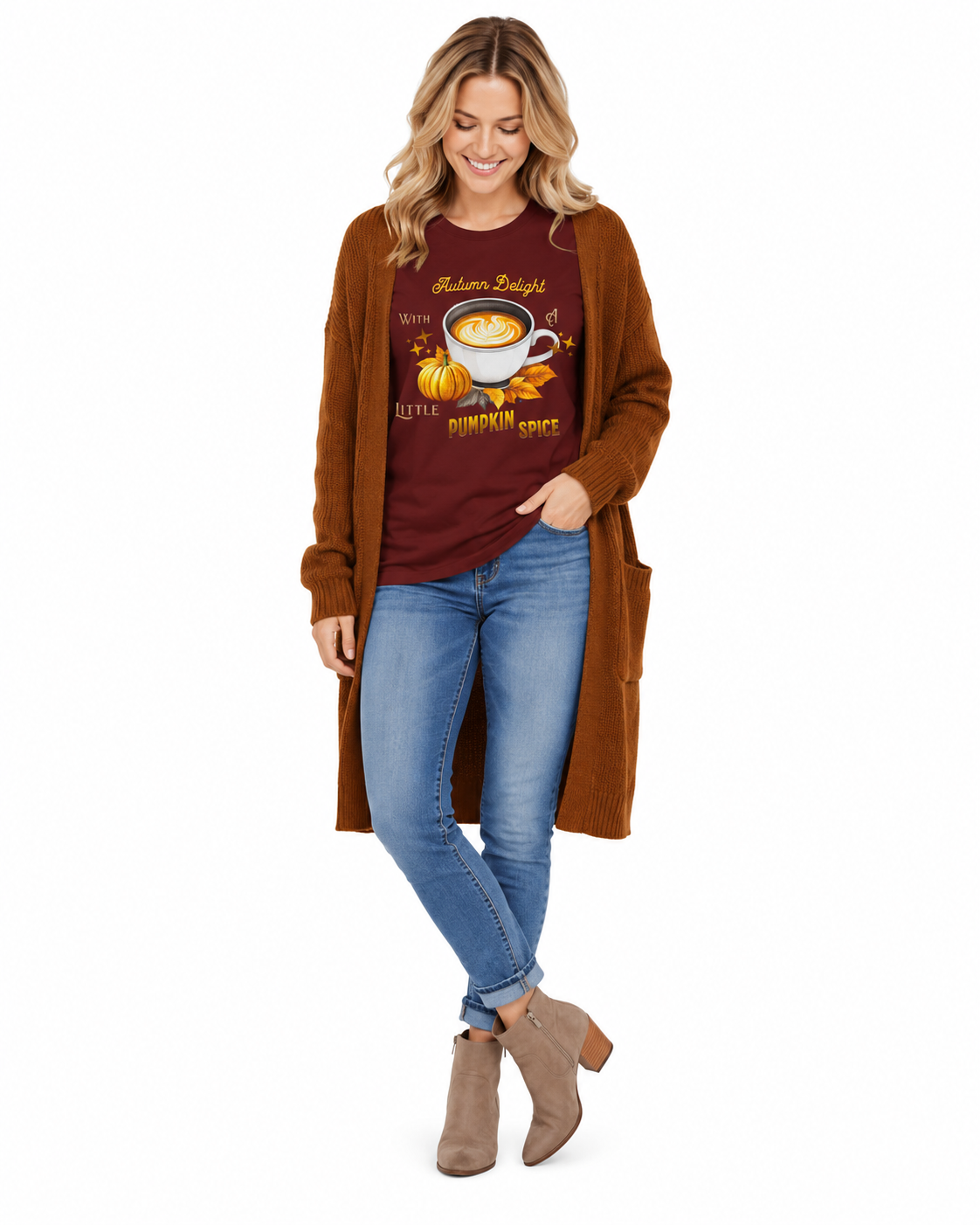 A woman modeling a fall-themed outfit consisting of a rust brown open-front cardigan, a dark red graphic t-shirt with a pumpkin and coffee cup design, blue jeans, and taupe ankle boots, set against a plain white background.