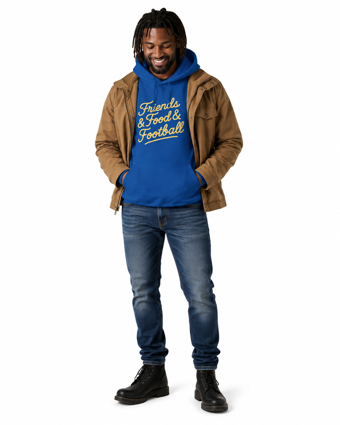 A man wearing a royal blue hoodie with 'Friends & Food & Football' printed in yellow on the front, layered under a brown suede jacket, blue jeans, and black boots, standing against a plain white background.