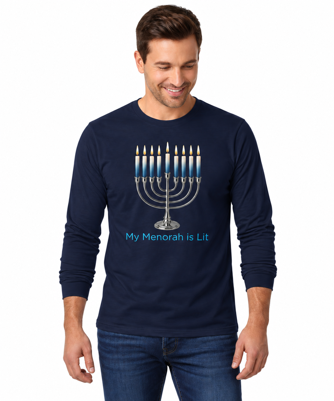 A man wearing a navy blue long-sleeve t-shirt with a graphic of a lit menorah and the text 'My Menorah is Lit' in blue, paired with blue jeans, against a plain white background.