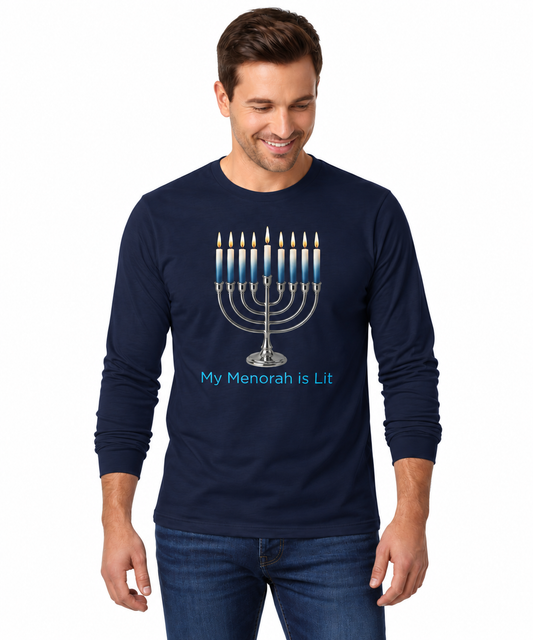 A man wearing a navy blue long-sleeve t-shirt with a graphic of a lit menorah and the text 'My Menorah is Lit' in blue, paired with blue jeans, against a plain white background.