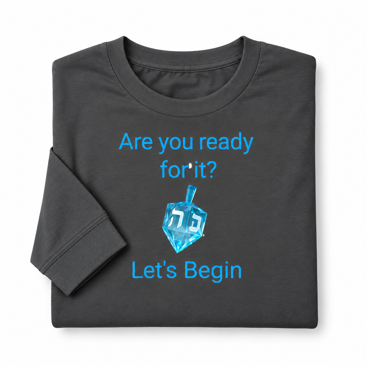 A folded dark gray long-sleeve t-shirt with a blue graphic print that reads 'Are you ready for it? Let's Begin' alongside a blue dreidel illustration, shown on a plain white background.