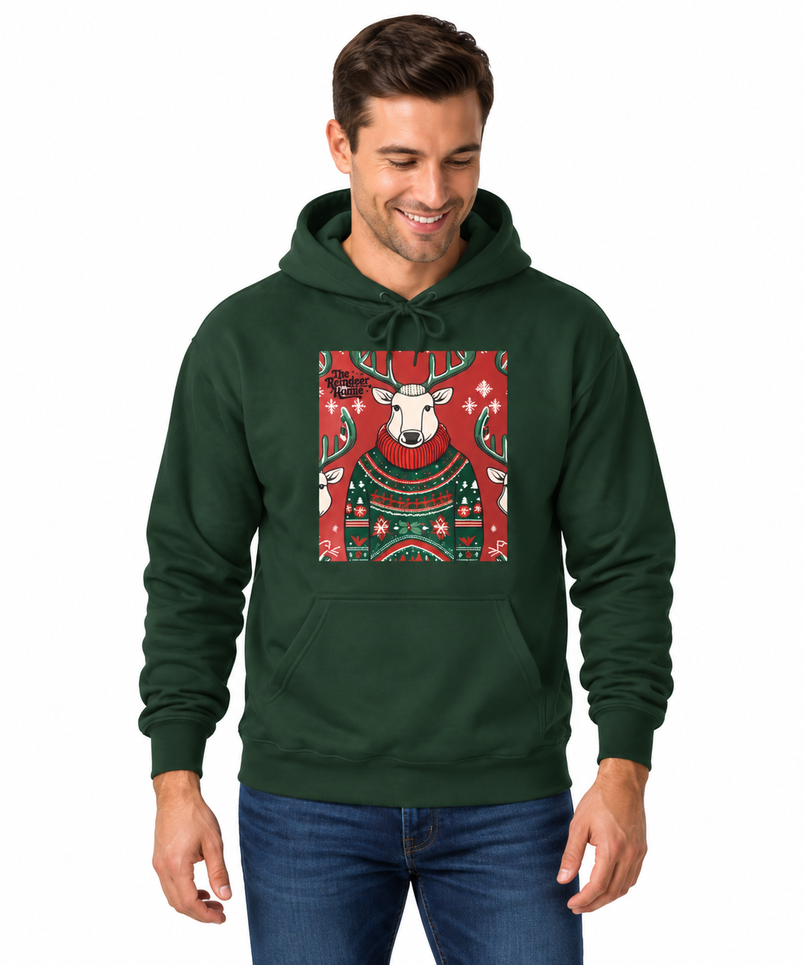 A man wearing a dark green pullover hoodie with a festive Christmas-themed graphic print of a white sheep in a red sweater on the chest, paired with blue jeans against a plain white background.
