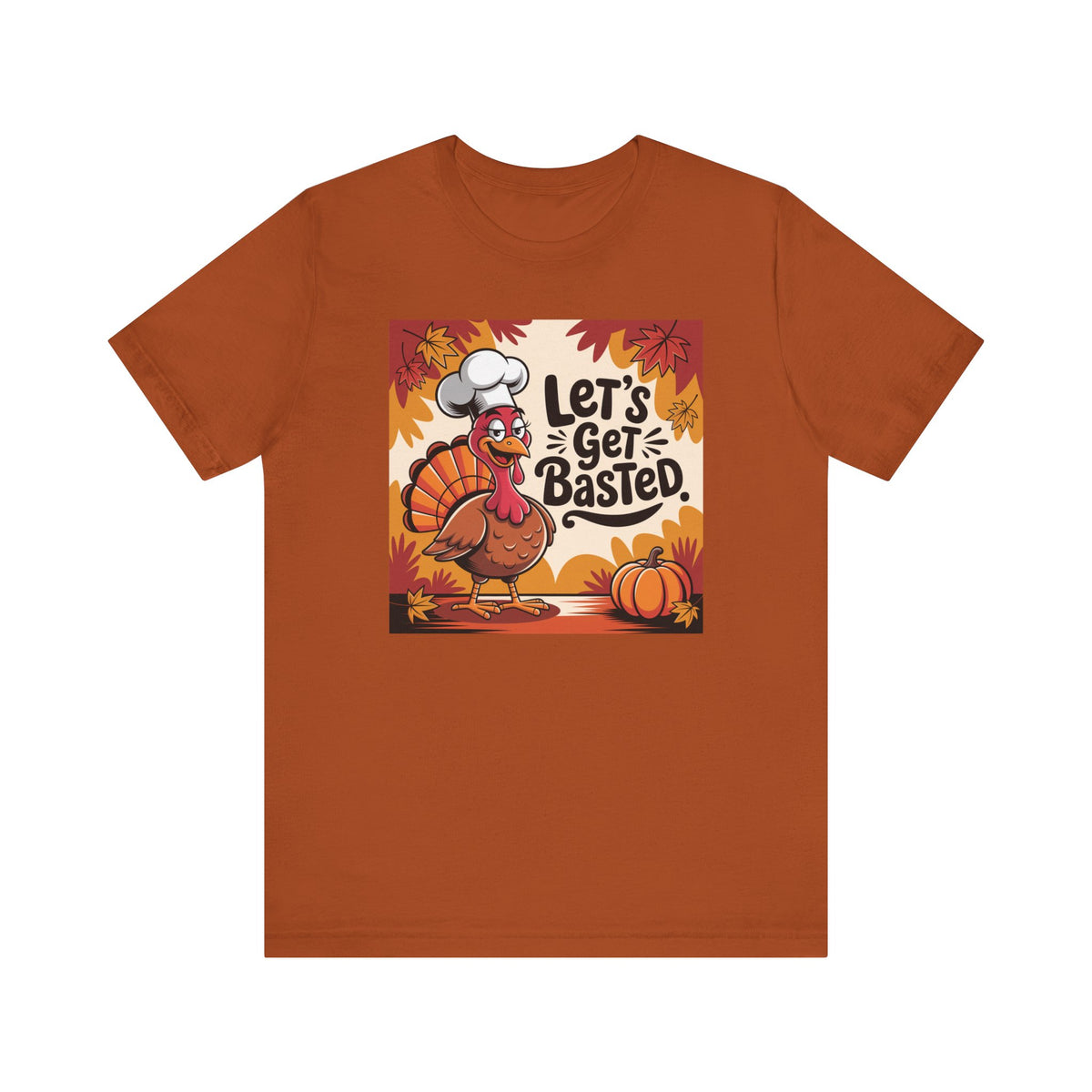 An orange short-sleeve crewneck t-shirt featuring a central graphic of a cartoon turkey wearing a chef's hat with the text 'Let's Get Basted.' in autumn colors, displayed on a solid white background.