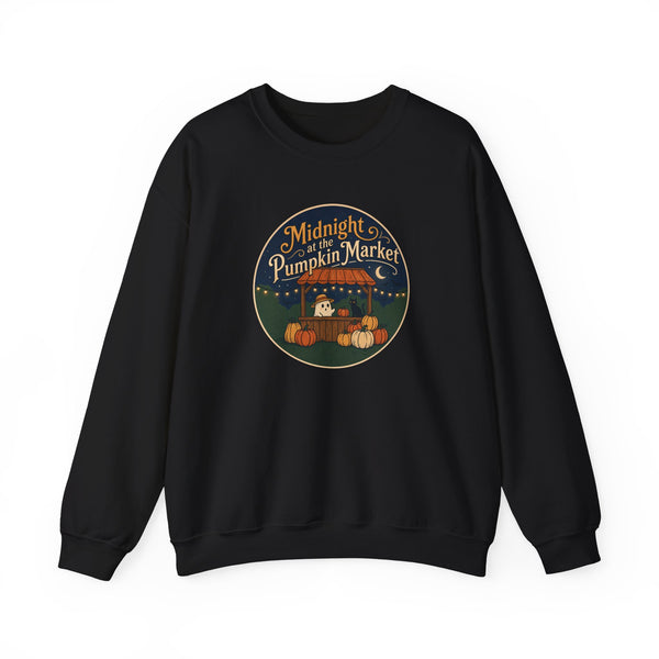 A black crewneck sweatshirt with a circular graphic on the chest reading 'Midnight of the Pumpkin Market' in a stylized autumn market scene with pumpkins and a moon.