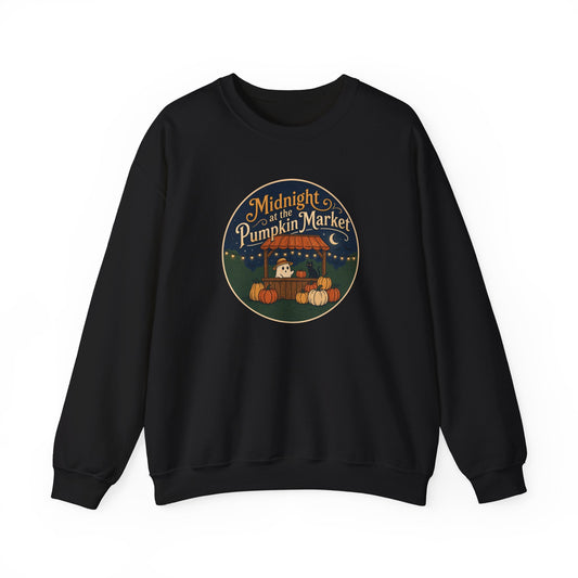 A black crewneck sweatshirt with a circular graphic on the chest reading 'Midnight of the Pumpkin Market' in a stylized autumn market scene with pumpkins and a moon.