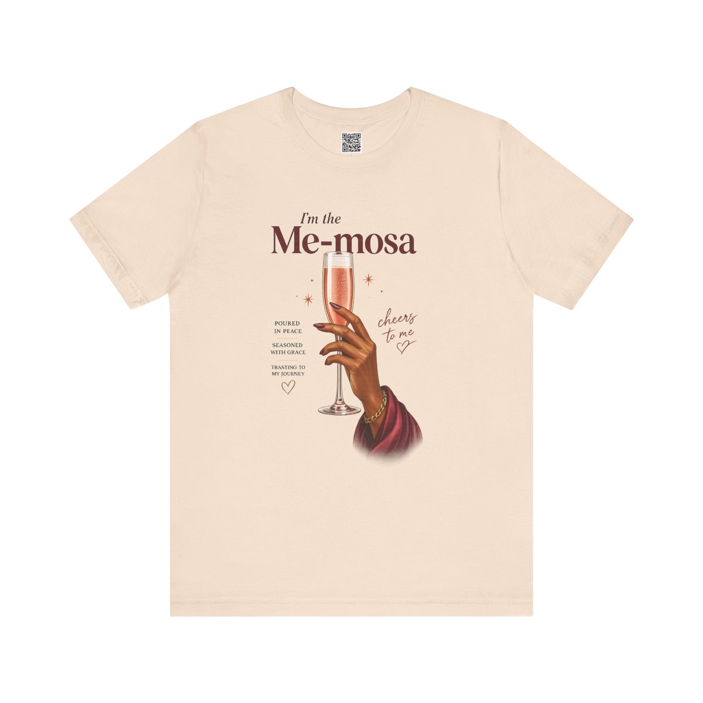 Beige t-shirt with a graphic of a hand holding a glass of mimosas and text on a white background