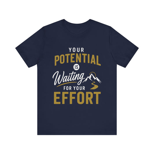A navy blue short-sleeve t-shirt with a motivational graphic on the front that reads 'YOUR POTENTIAL IS Waiting FOR YOUR EFFORT' in white and gold lettering, accompanied by a small mountain illustration.