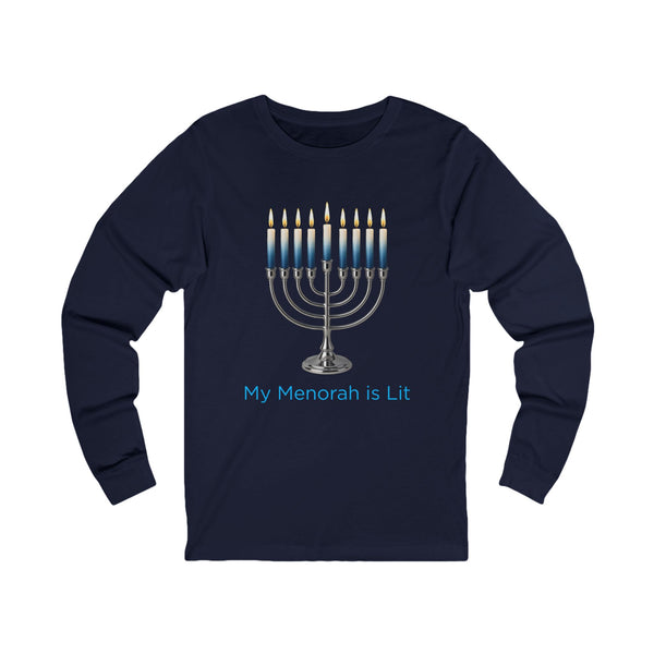 A navy blue long-sleeve t-shirt with a graphic of a lit silver menorah and the text 'My Menorah is Lit' in light blue, displayed on a solid white background.