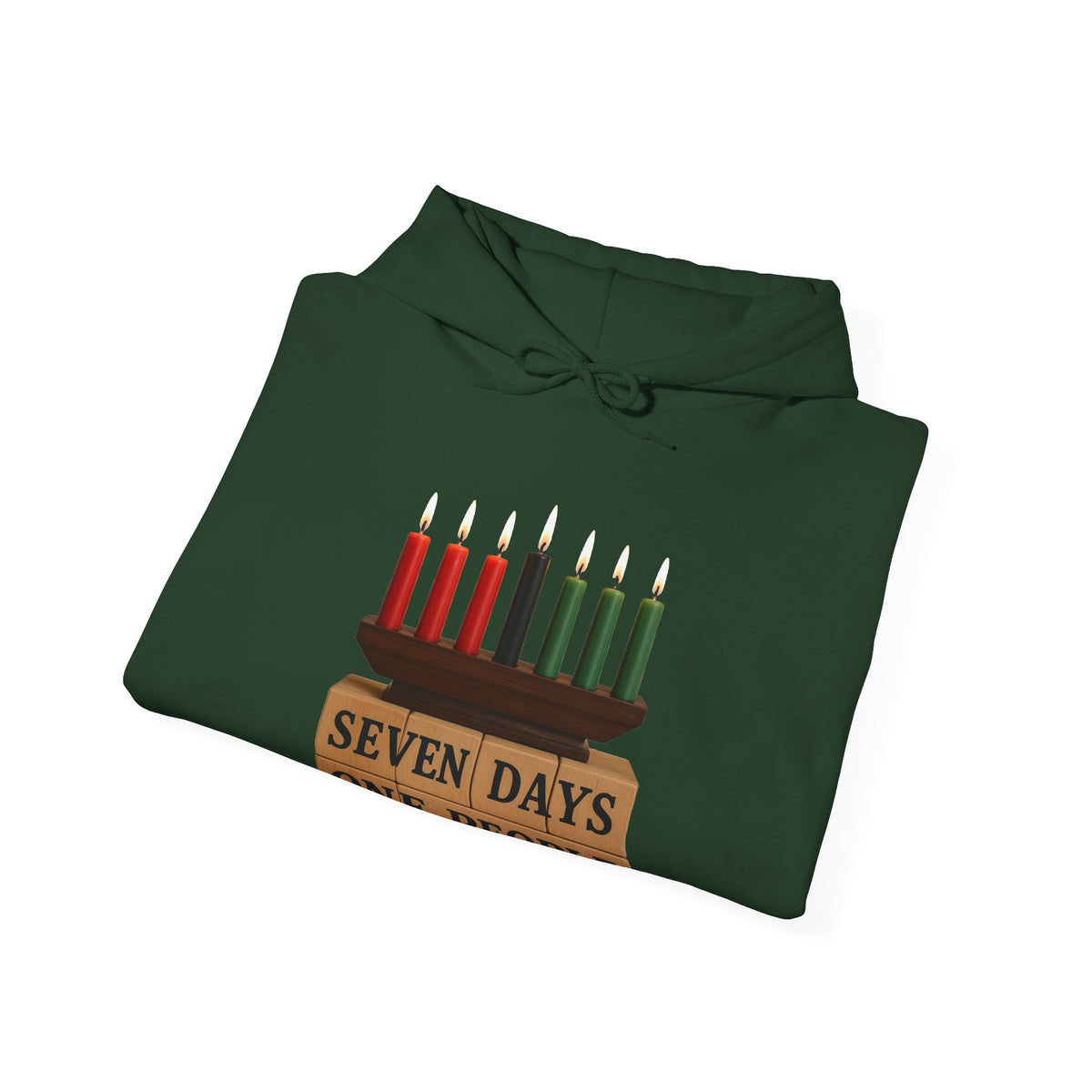 A dark forest green hoodie folded flat on a white background, featuring a graphic of a Hanukkah menorah with red, black, and green candles on top of wooden blocks that read 'SEVEN DAYS'.