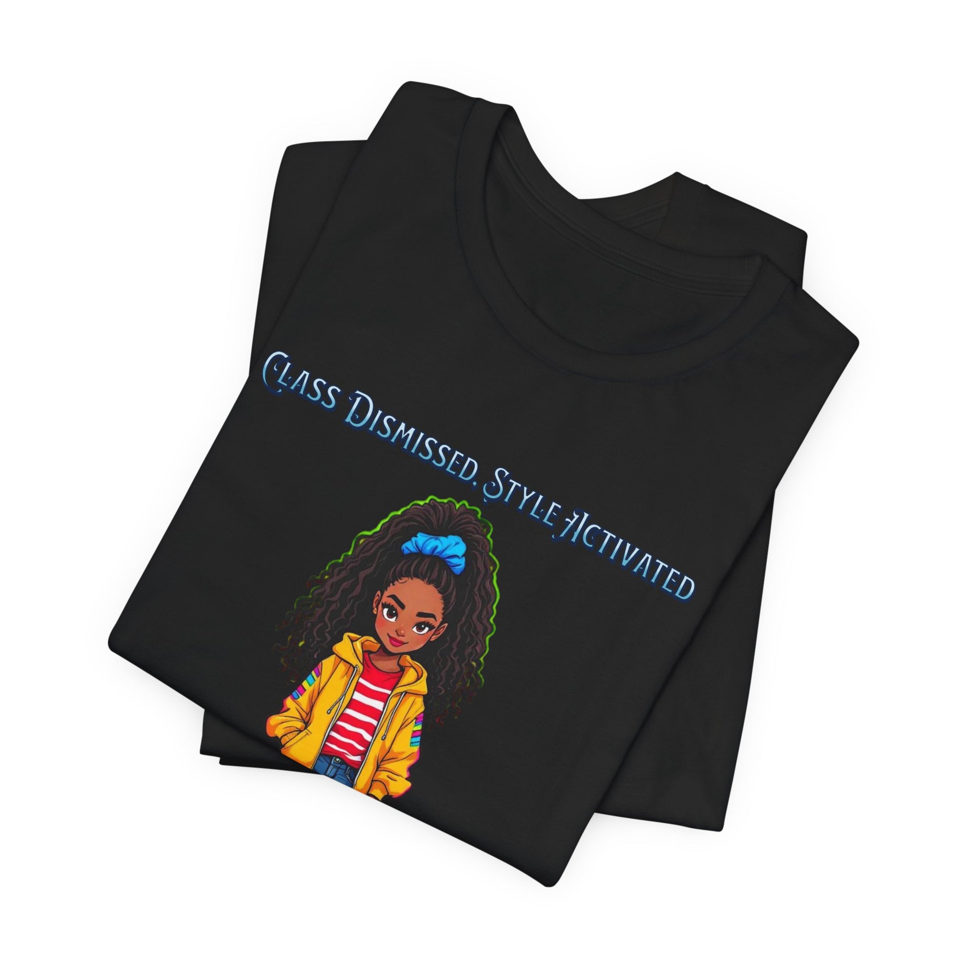 A folded black t-shirt on a white background, featuring a graphic of a cartoon girl with curly hair wearing a yellow jacket and blue hair tie, with the text 'CLASS DISMISSED STYLE ACTIVATED' in blue.