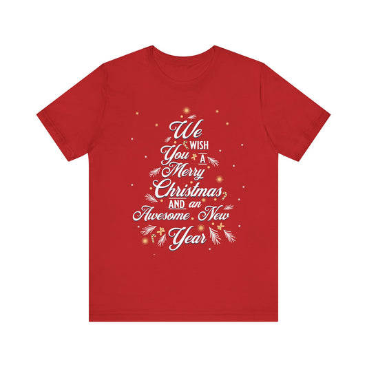 A red short-sleeve crewneck t-shirt with a white graphic text design that reads 'We Wish You A Merry Christmas, and an Awesome New Year' decorated with white pine branches and small gold star accents, shown on a plain white background.