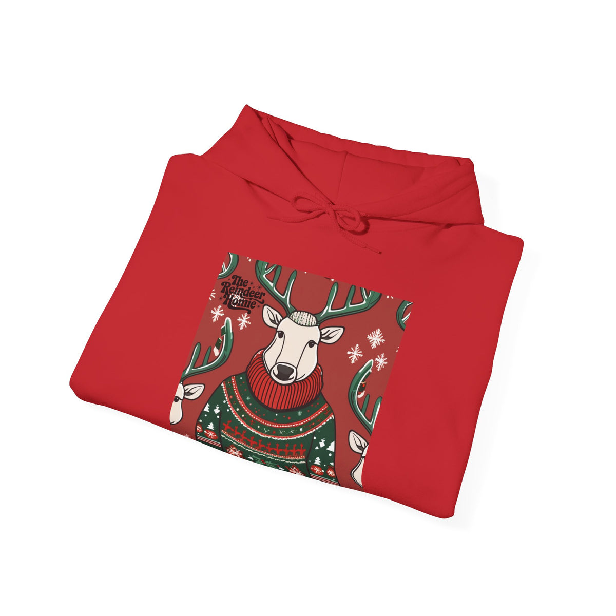 A folded red hoodie with a festive Christmas graphic of a reindeer wearing a green and red knit sweater, set against a plain white background.