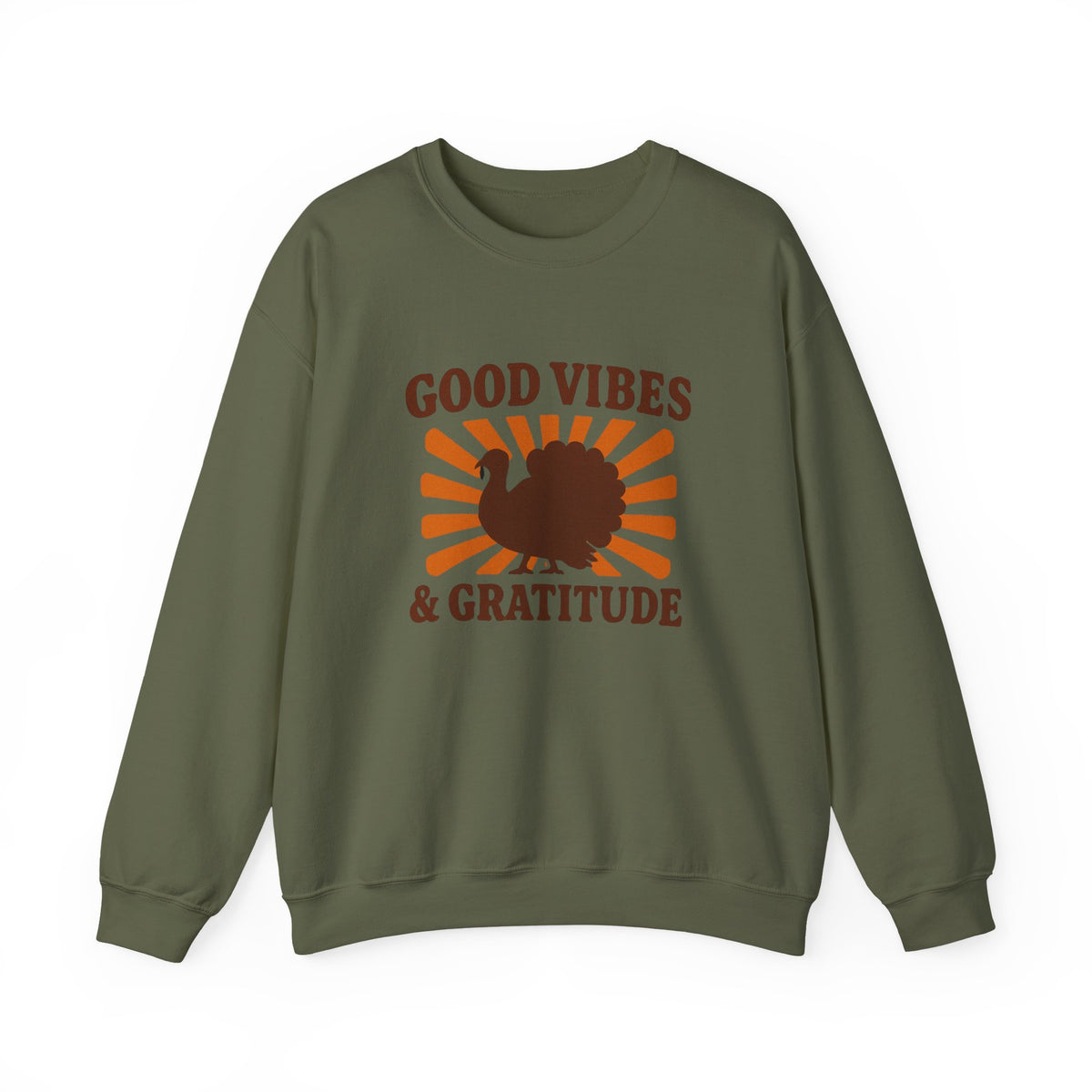 An olive green crewneck sweatshirt featuring a brown turkey silhouette and the words 'GOOD VIBES & GRATITUDE' over an orange sunburst graphic on the front, displayed against a solid white background.