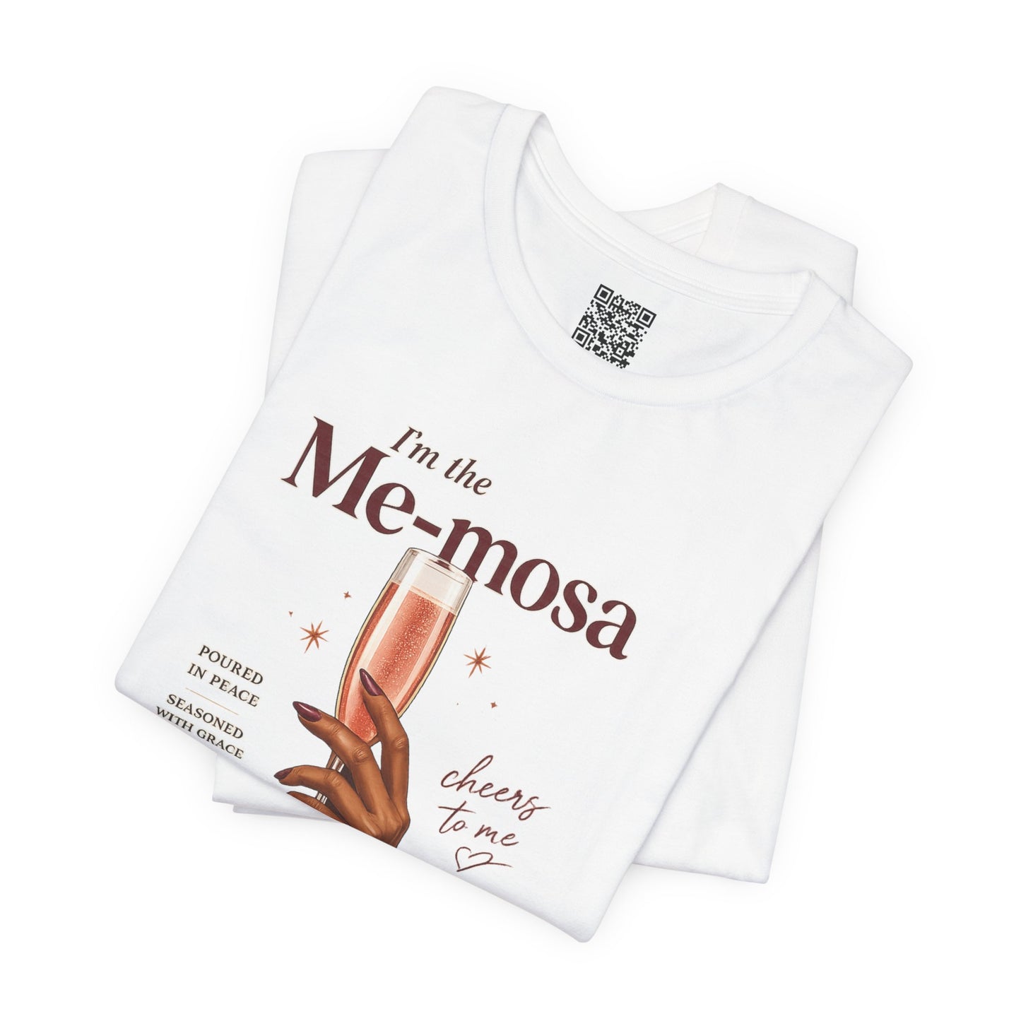 White folded t-shirt with a graphic design and text on a white background
