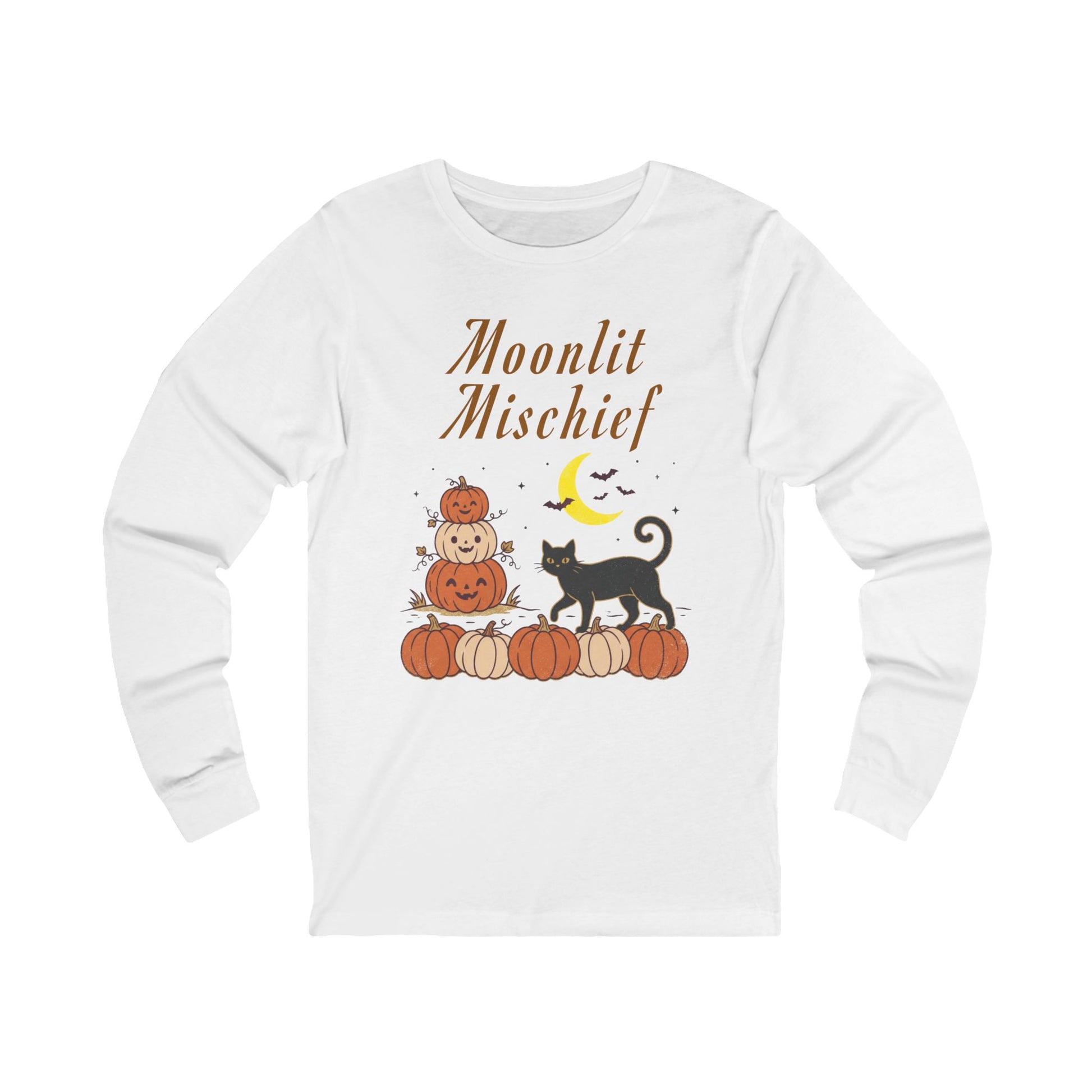 A white long-sleeve t-shirt with a Halloween graphic on the front. The graphic features the text 'Moonlit Mischief' in brown script above a stack of pumpkins with a jack-o'-lantern, a black cat, a yellow crescent moon, and small bats.