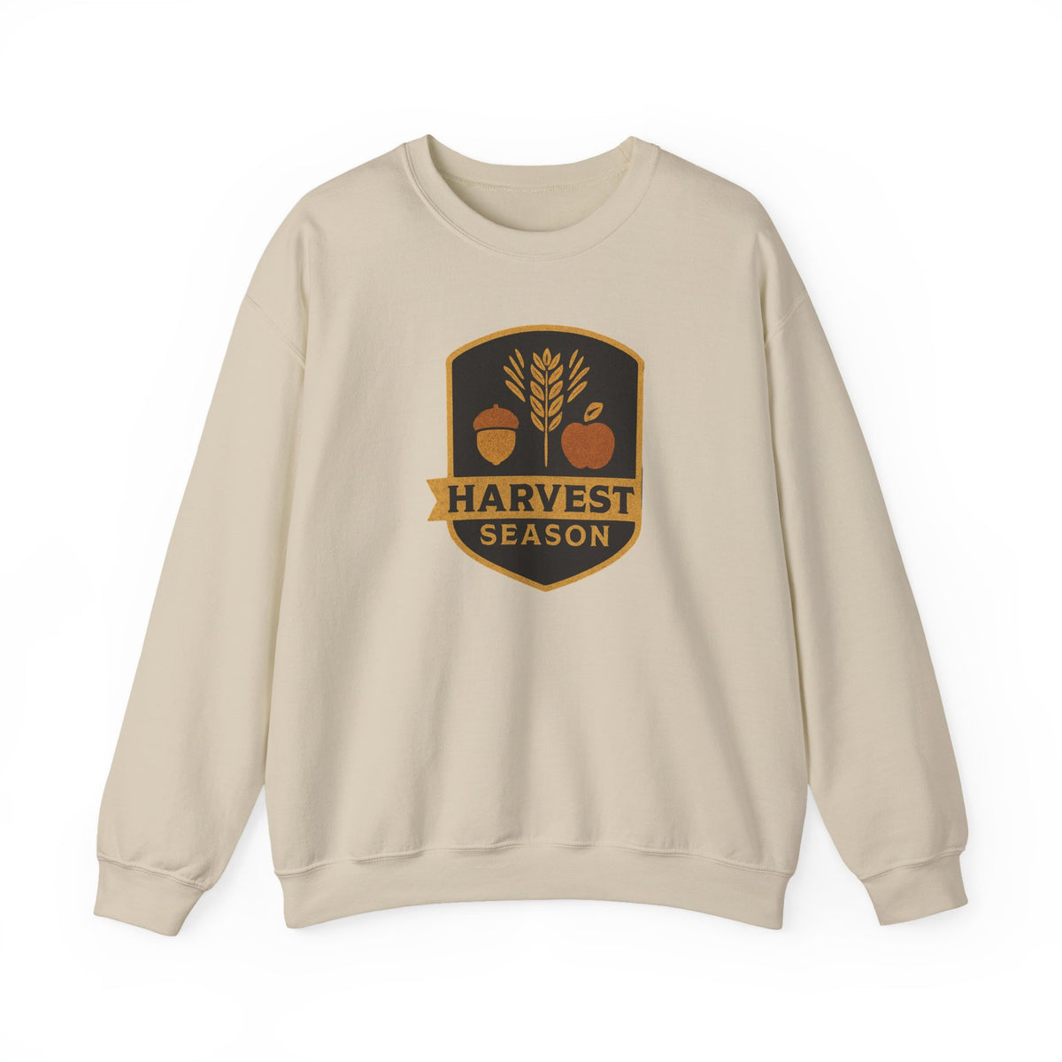 A light beige crewneck sweatshirt with a 'Harvest Season' graphic on the chest, featuring an acorn, wheat stalk, and pumpkin in autumn colors.