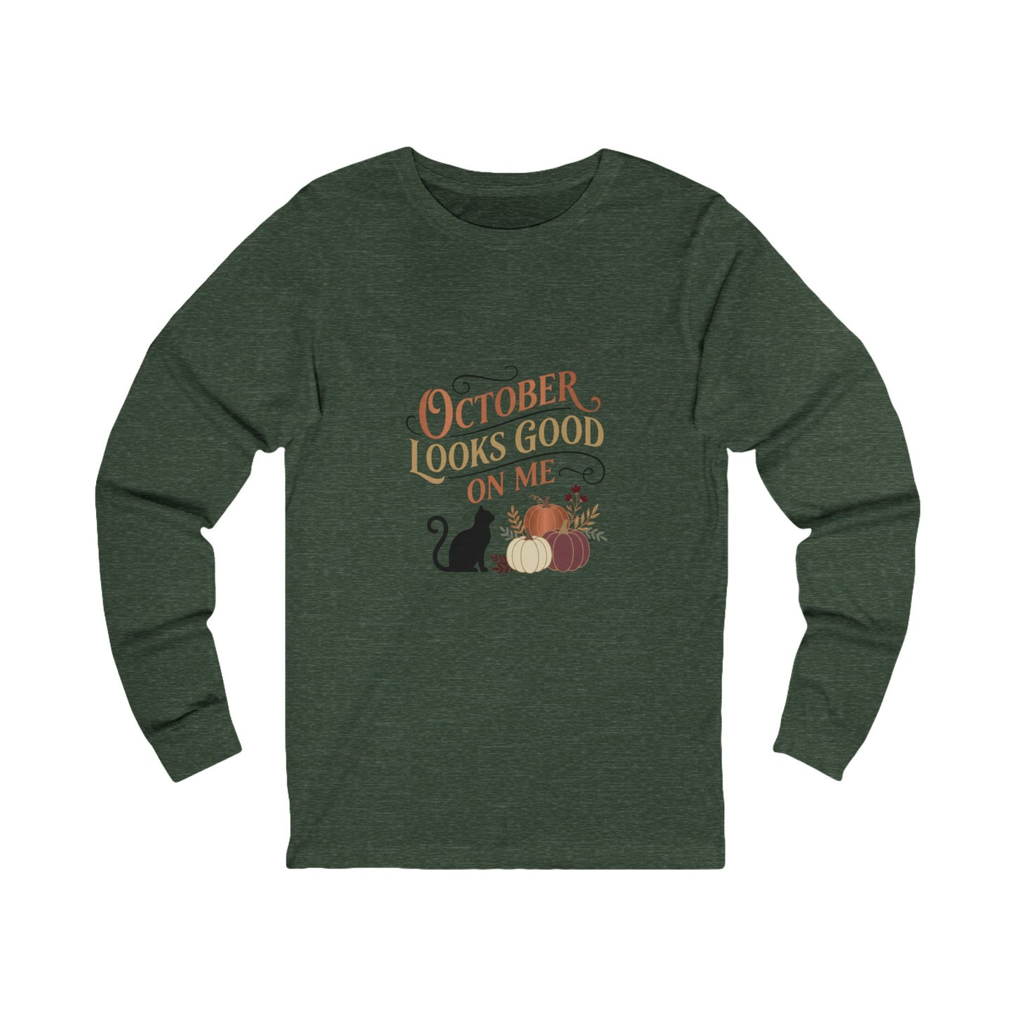 A dark heather green long-sleeve t-shirt with a graphic on the chest that reads 'OCTOBER LOOKS GOOD ON ME' in orange and brown lettering, accompanied by a black cat, pumpkins, and autumn leaves.