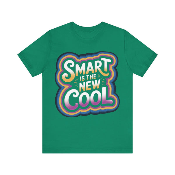 A green short-sleeve crewneck t-shirt featuring a colorful retro-style graphic on the chest that reads 'SMART IS THE NEW COOL' in white, yellow, orange, pink, and blue gradient lettering.