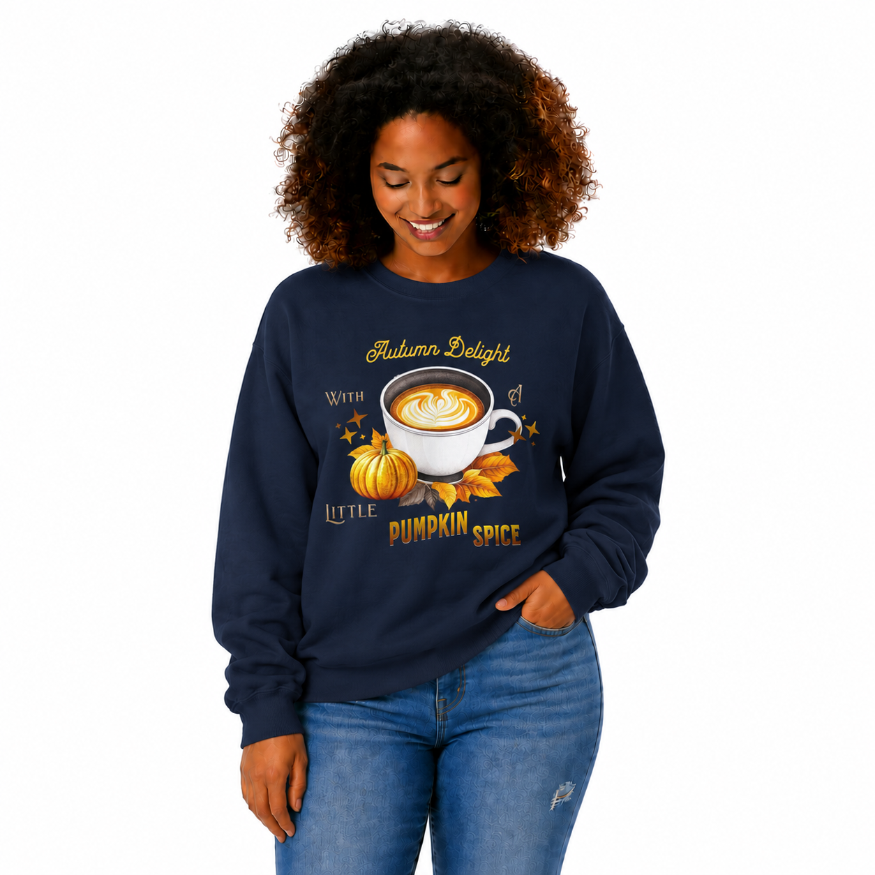 A woman with curly brown hair wearing a navy blue crewneck sweatshirt with a 'Autumn Delight With a Little Pumpkin Spice' graphic, paired with blue jeans, against a plain white background.