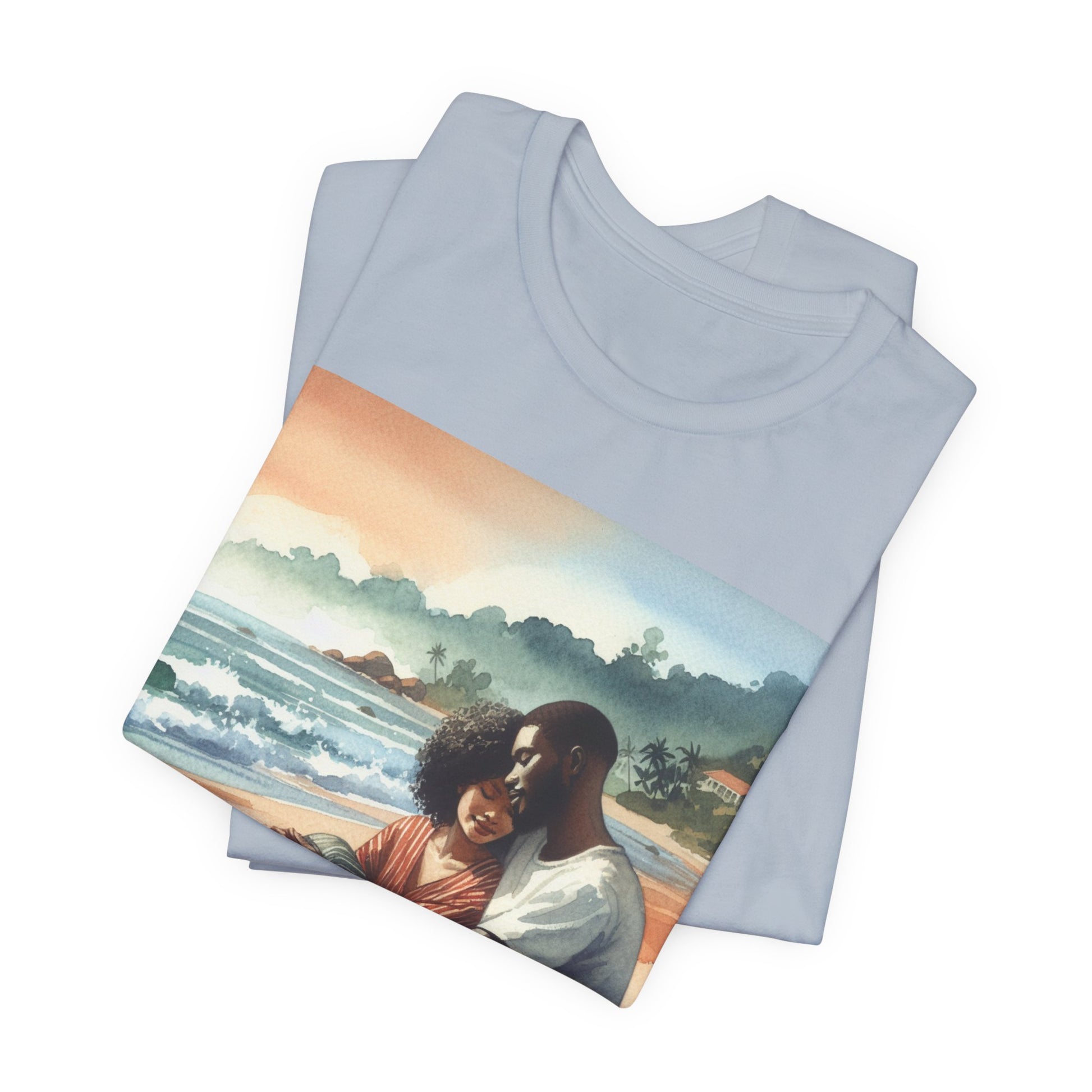 Folded t-shirt with a scenic design of a couple on a beach.