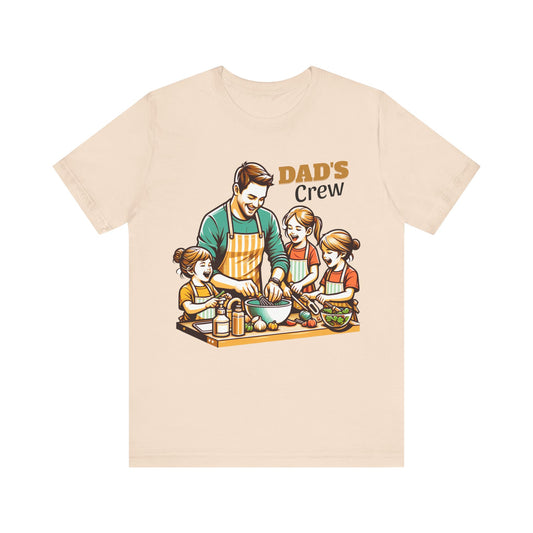Soft Cream t-shirt with a graphic of a father and his two daughters cooking, labeled 'Dad's Crew'.