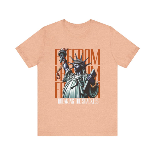 Heather peach t-shirt with Statue of Liberty graphic and 'Freedom' text on a white background