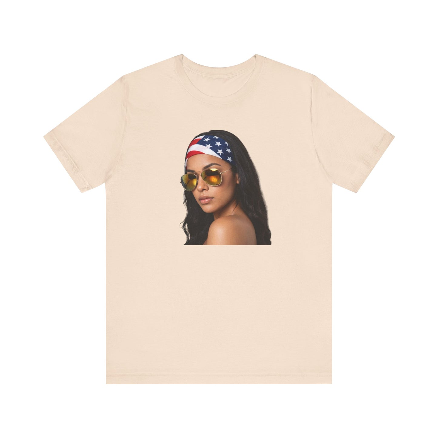 Cream t-shirt with a graphic of a woman wearing sunglasses and an American flag headband on a white background.